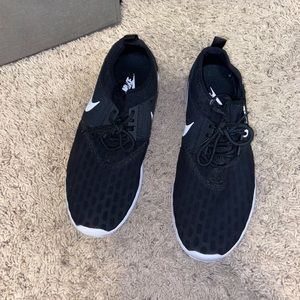 Womens black Nike athletic shoes